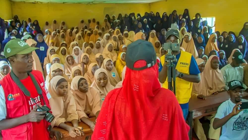 Youth beneficiaries participating in community development activities